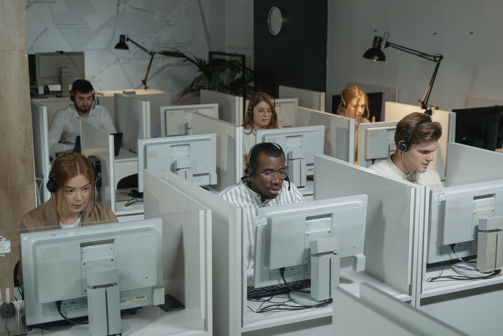 Customer support team working across a live call center